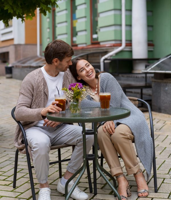 happy-couple-taking-drinks-terrace